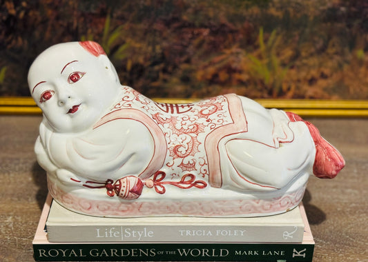 Pink and white Asian resting boy 14 l 6 w 6 h