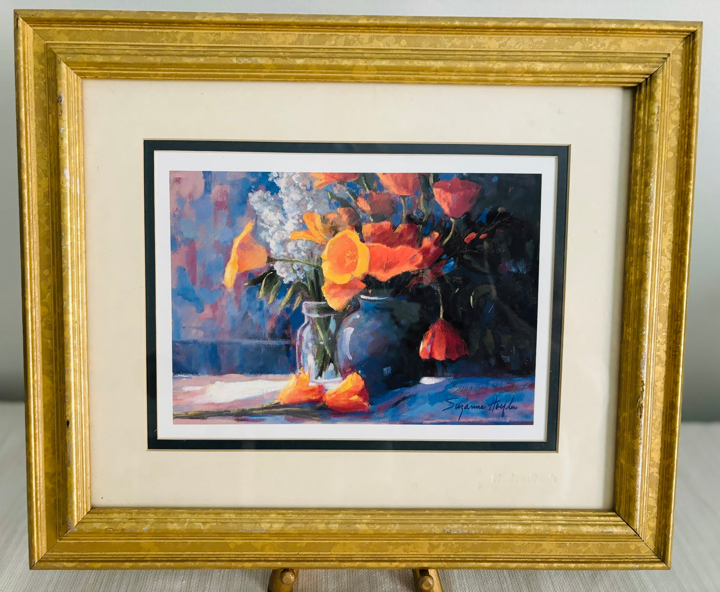 Framed blue and orange print with blue vases and bright orange flowers print 15 x 12