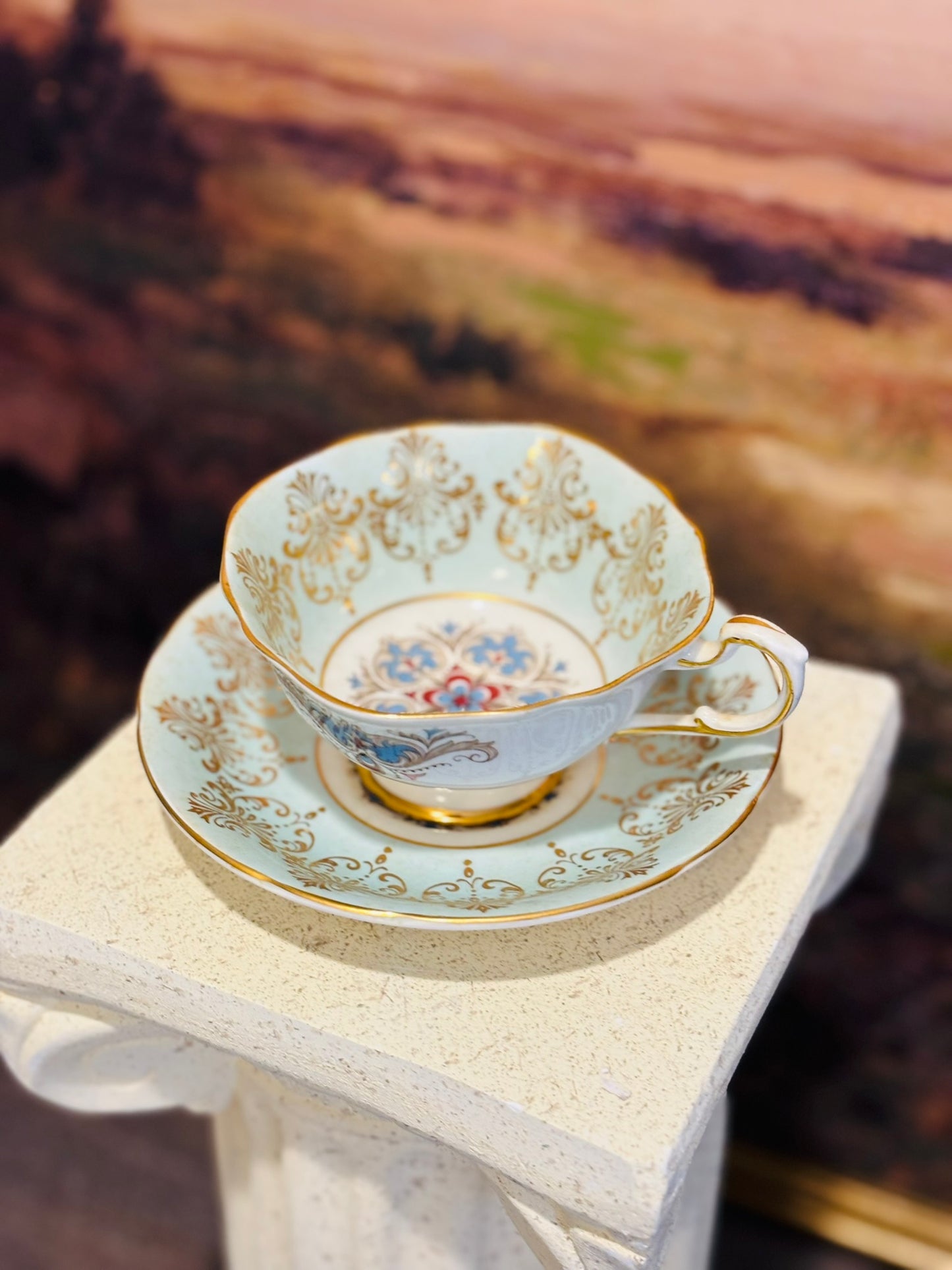 Paragon Beautiful Blue Teacup and Saucer w/gold mandala medallion