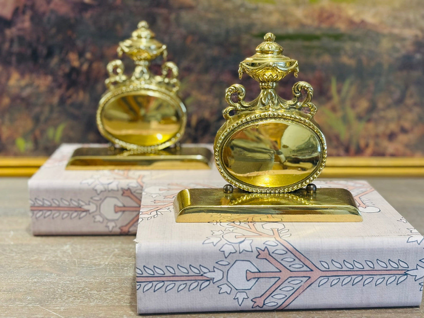 Brass bookends with urns  6.75 w 2 d 6.5 h