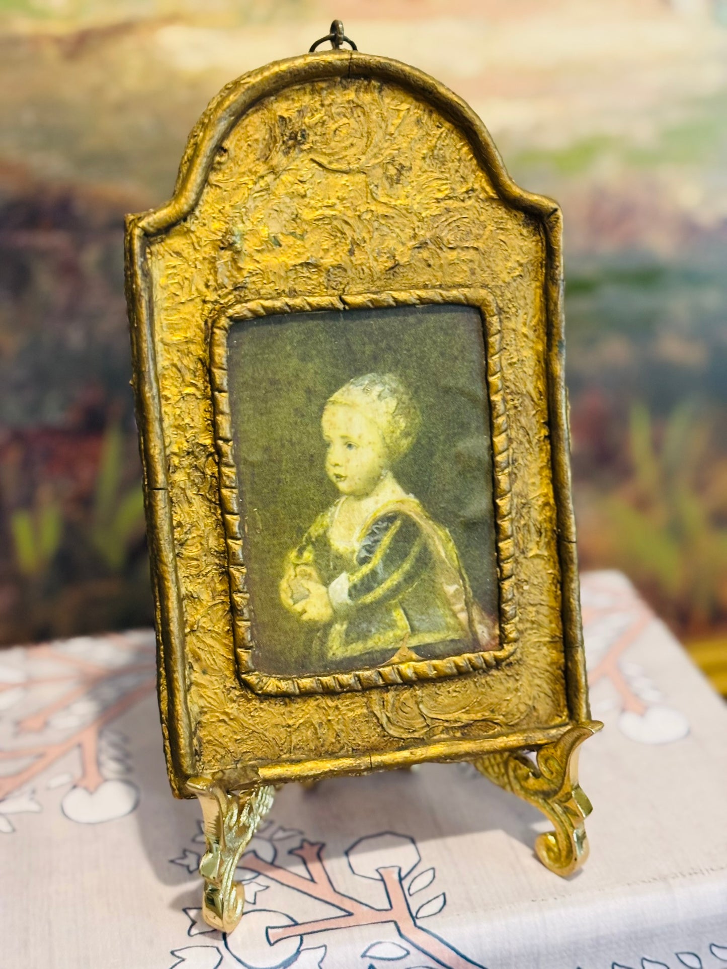 Gold framed bonnet  7 h 4.25 w .5 d