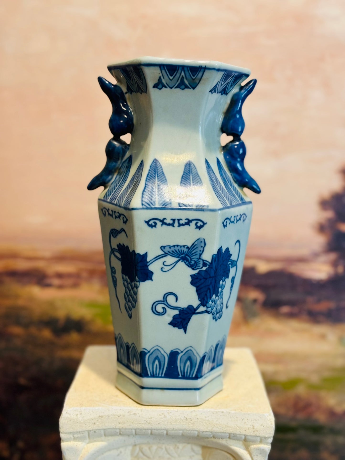B & W Shaped vase with blue handles 10 h 4.75 d/w